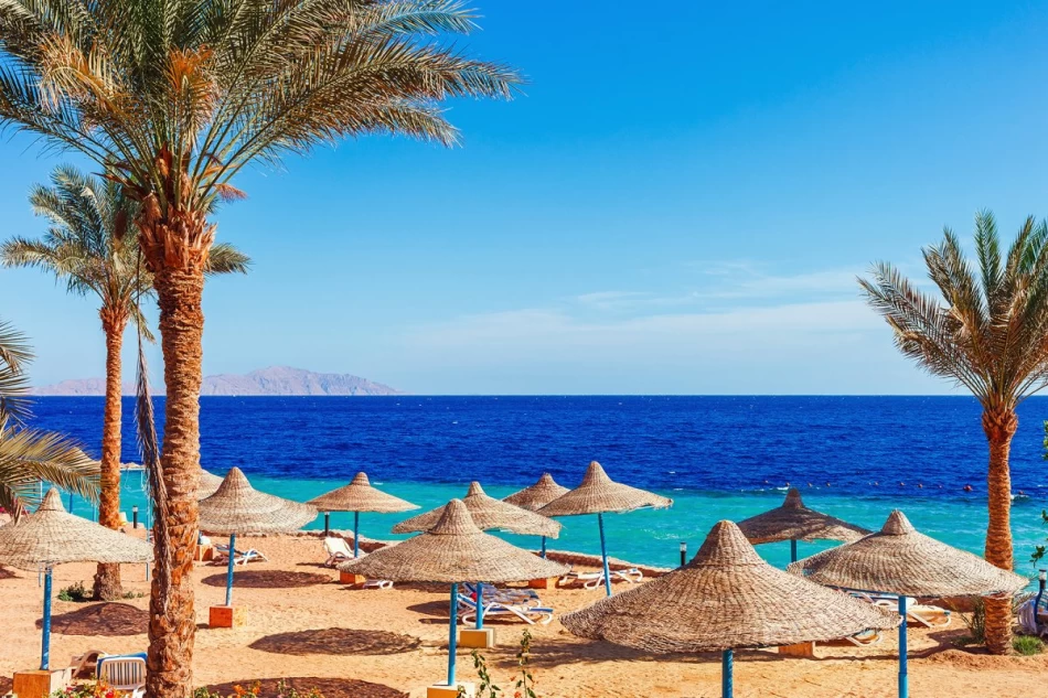 Sunny sandy beach with crystal clear waters in Hurghada, Red Sea