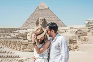 Tourist exploring the Great Pyramids of Giza on a sunny day
