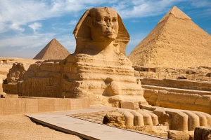The Great Pyramids of Giza and the Sphinx under a clear blue sky