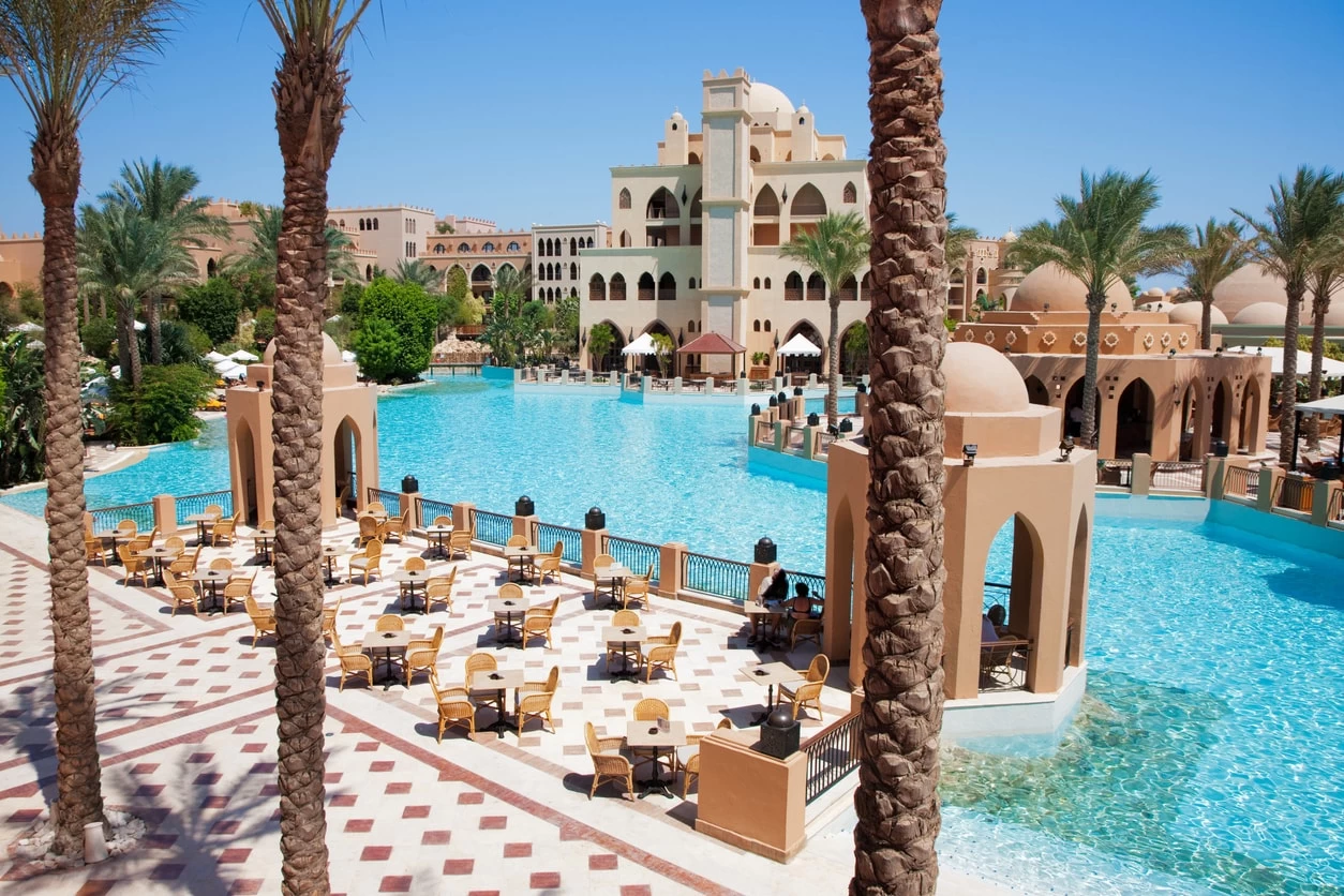 Stunning luxury beach view in Hurghada with clear blue water and palm trees