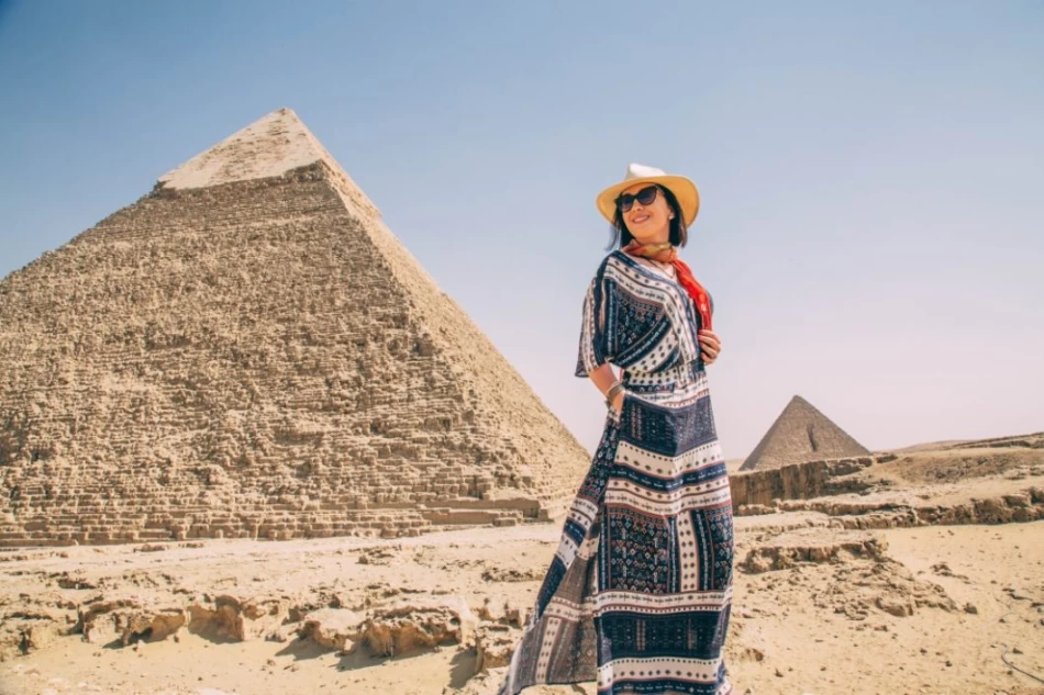 Visitor standing and admiring the Pyramids of Giza, Egypt