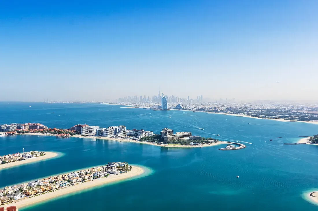Dubai Marina skyline featuring luxury skyscrapers, yachts, and waterfront views